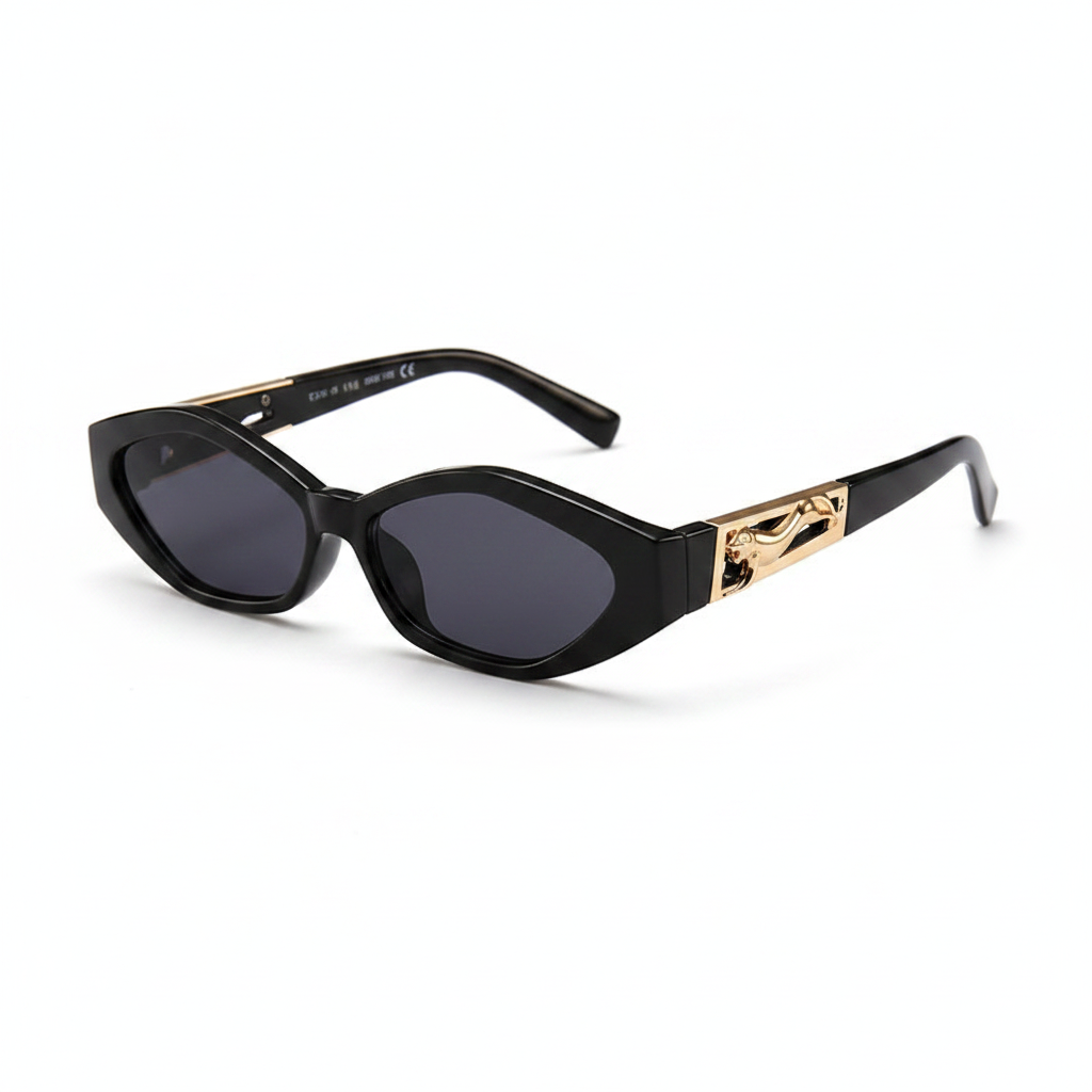 Oval sunglasses with a black frame and gradient gray lenses, featuring a decorative gold-toned metal emblem on the temple arm.